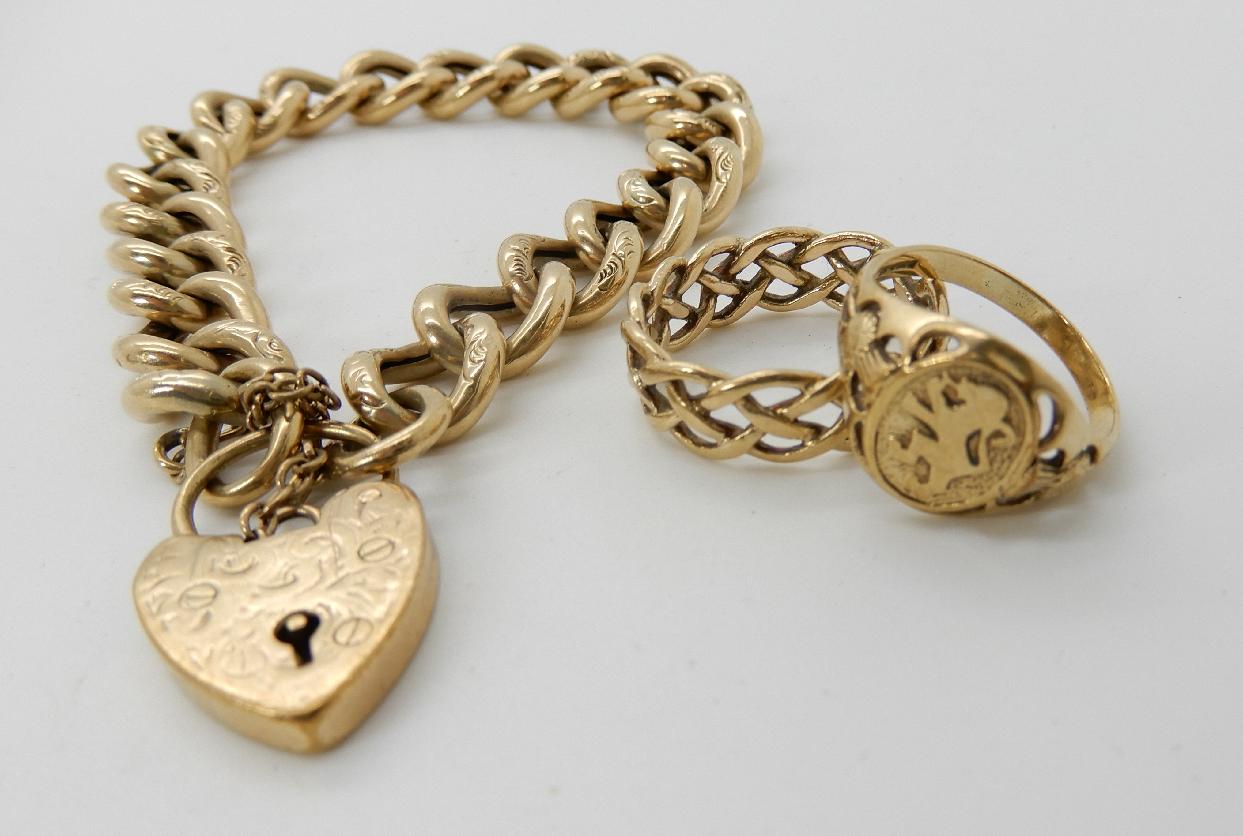 A 9ct gold engraved link curb bracelet with heart shaped clasp, length 19cm, a 9ct Celtic knotwork - Image 2 of 3