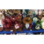 A collection of cranberry glass including Mary Gregory style vase, other examples and a quantity