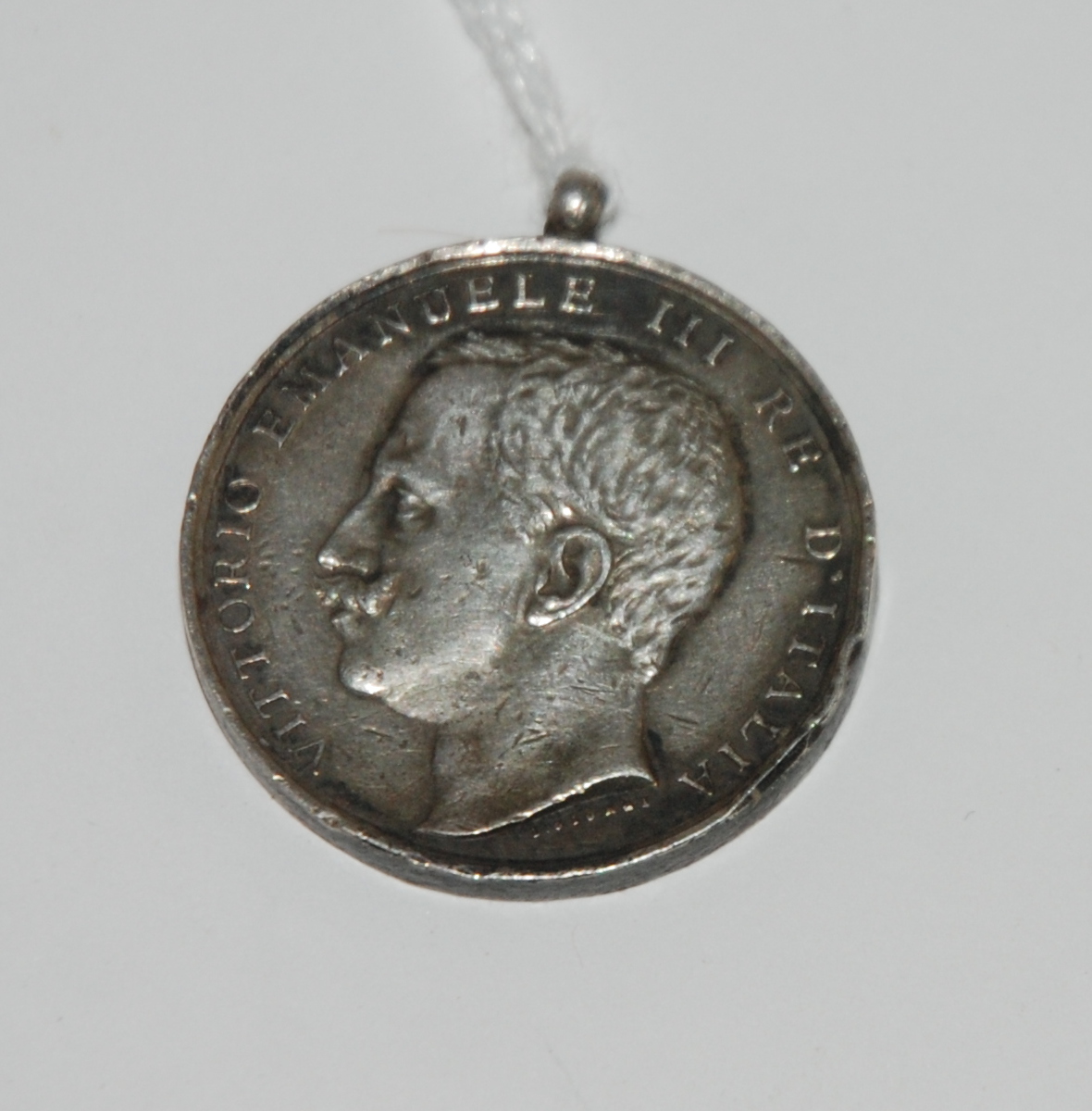 A white-metal Messina medal, (earthquake rescue medal 1908), issued to people who aided in the