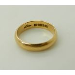 An 18ct gold Glasgow hallmarked wedding band, size N, weight 4.6gms Condition Report: Available upon