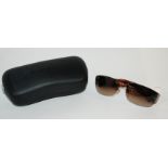 A pair of stamped Chanel sunglasses Condition Report: Available upon request