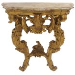 A ROCOCO STYLE GILT CONSOLE TABLE with shaped marble top, the base with two foliate carved legs