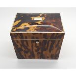 A REGENCY TORTOISESHELL TEA CADDY of rectangular form, with hinged lid with single lidded