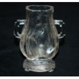 A CHINESE ROCK CRYSTAL BALUSTER VASE carved with blossoming branches, flanked by angular handles and