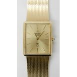 A LADIES 14K GOLD CONCORD QUARTZ WATCH with gold coloured dial baton numerals and blue gem set