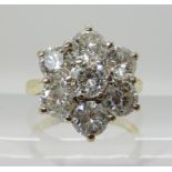 AN 18CT GOLD DIAMOND FLOWER RING of estimated approx 3cts in total, finger size N1/2, weight 5.