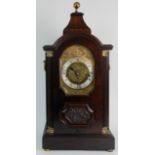 A WESTMINISTER CHIMING BRACKET CLOCK the chased brass dial with silvered chapter ring and roman