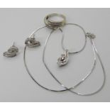AN 18CT WHITE GOLD DIAMOND SET SUITE OF JEWELLERY comprising of a pendant, ring and earrings, set