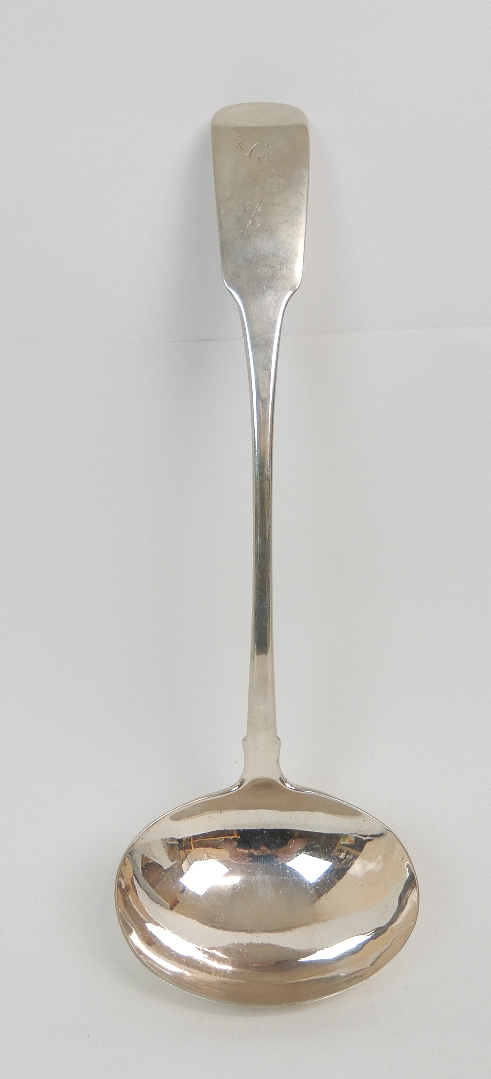 A SCOTTISH PROVINCIAL SILVER SOUP LADLE by John Ewan, Aberdeen circa 1832, fiddle pattern with