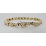 A 14K GOLD DIAMOND FLOWER BRACELET set with estimated approx 3.20cts of brilliant cut diamonds,