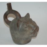 A PRE COLOMBIAN POTTERY LEOPARD HEAD VESSEL with painted details, 19cm high, bloated animal