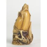 A JAPANESE IVORY NETSUKE coloured and carved with a snail wrapped around a corn tassle, signed, 5m