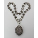A VICTORIAN SILVER LOCKET AND CHAIN the locket is hallmarked London 1885-6, with star, granulation