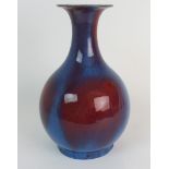A CHINESE FLAMBE BALUSTER VASE 20th Century, 30cm high Condition Report: Available upon request