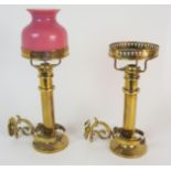 A PAIR OF BRASS VICTORIAN SHIP'S WALL LANTERNS with gimble fittings, with one shade, 28cm high