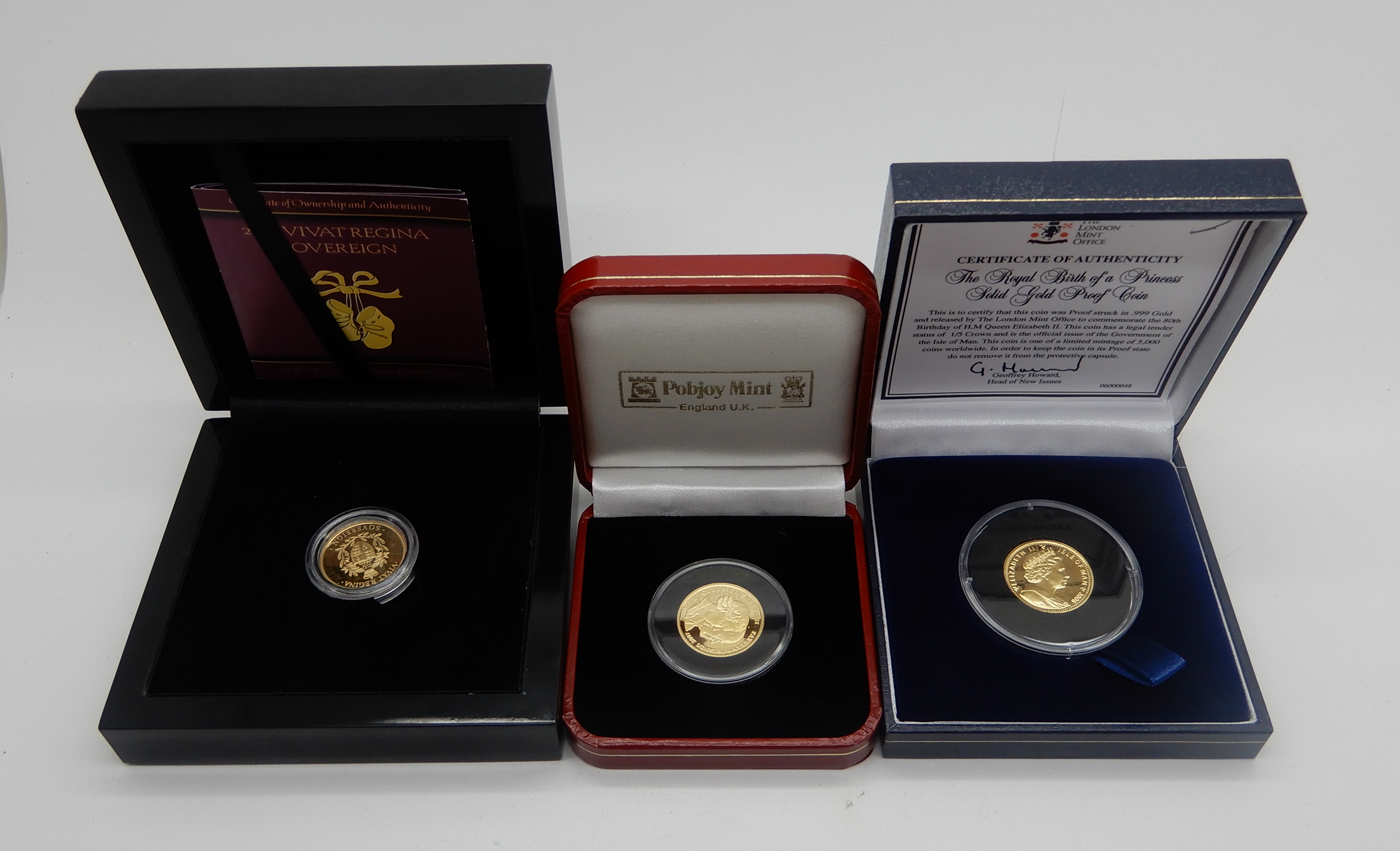 A CASED GOLD VIVAT REGINA SOVEREIGN with certificate with two cased 1/5 crown gold coins, The