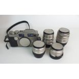 A CONTAX G2 RANGEFINDER CAMERA OUTFIT, SERIAL NUMBER 051156 with four Carl Zeiss lenses including T*