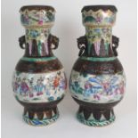 A PAIR OF CHINESE ARCHAIC STYLE CRACKLEWARE TWO HANDLED VASES each painted with panels of figures