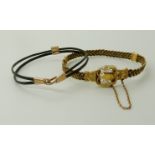 TWO ELEPHANT HAIR BANGLES the first with plaited design twisted wire work and filigree clasp and