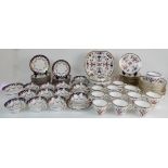 A MINTON IMARI PATTERN TEASET comprising two cake plates, twelve cups, saucers and plates, milk