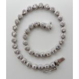AN 18CT WHITE GOLD DIAMOND LINE BRACELET set with estimated approx 4cts of brilliant cut diamonds,