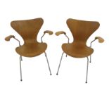 A PAIR OF ARNE JACOBSEN FOR FRITZ HANZEN ARMCHAIRS the plywood one piece seat and back and arms on a