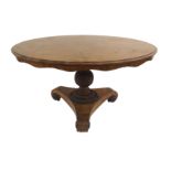 A VICTORIAN QUARTER VENEERED WALNUT TILT-TOP BREAKFAST TABLE with acanthus carved knop pedestal on