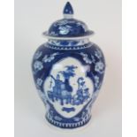 A CHINESE BLUE AND WHITE BALUSTER VASE AND COVER painted with panels of precious objects divided