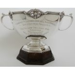 A SILVER TROPHY PUNCH BOWL by Carrington & Company, London 1911, of dodecagon form with six