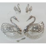 FOUR CONTINENTAL SILVER AND MOULDED GLASS TRINKET DISHES marked 925, modelled as swans, the