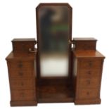 A VICTORIAN HOBBS OF LONDON PITCH PINE CHEVAL DRESSING TABLE with swivel mirror, the two pedestals