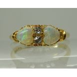 AN 18CT GOLD OPAL HEARTS AND DIAMOND RING dated Birmingham, 1899 - 1900, opals approx 5mm,