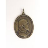 A CIRCA 17TH CENTURY OVAL MEDAL the obverse cast with a bust portrait in relief, the reverse