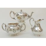 A MATCHED VICTORIAN SILVER THREE PIECE TEA SERVICE by Robert Harper, London 1867, the cream jug