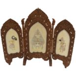 A CARVED THAI HARDWOOD THREE-FOLD ROOM DIVIDER the heavily carved frame with demonic head and