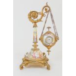 A 19TH CENTURY FRENCH TIMEPIECE the hand painted enamelled stand with ormolu mounts and scrolling