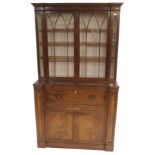 A GEORGIAN MAHOGANY SECRETAIRE BOOKCASE the upper section having two glazed doors and shelves, the
