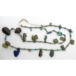 AN 'OF THE ANTIQUE' NECKLACE turquoise glazed baton beads with white metal flower spacers, with a