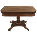 A VICTORIAN ROSEWOOD AND MAHOGANY FOLD-OVER CARD TABLE with baluster pedestal, with quatrefoil