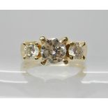 A 14K GOLD THREE STONE DIAMOND RING of estimated approx 1.30cts combined. finger size O, weight 6.