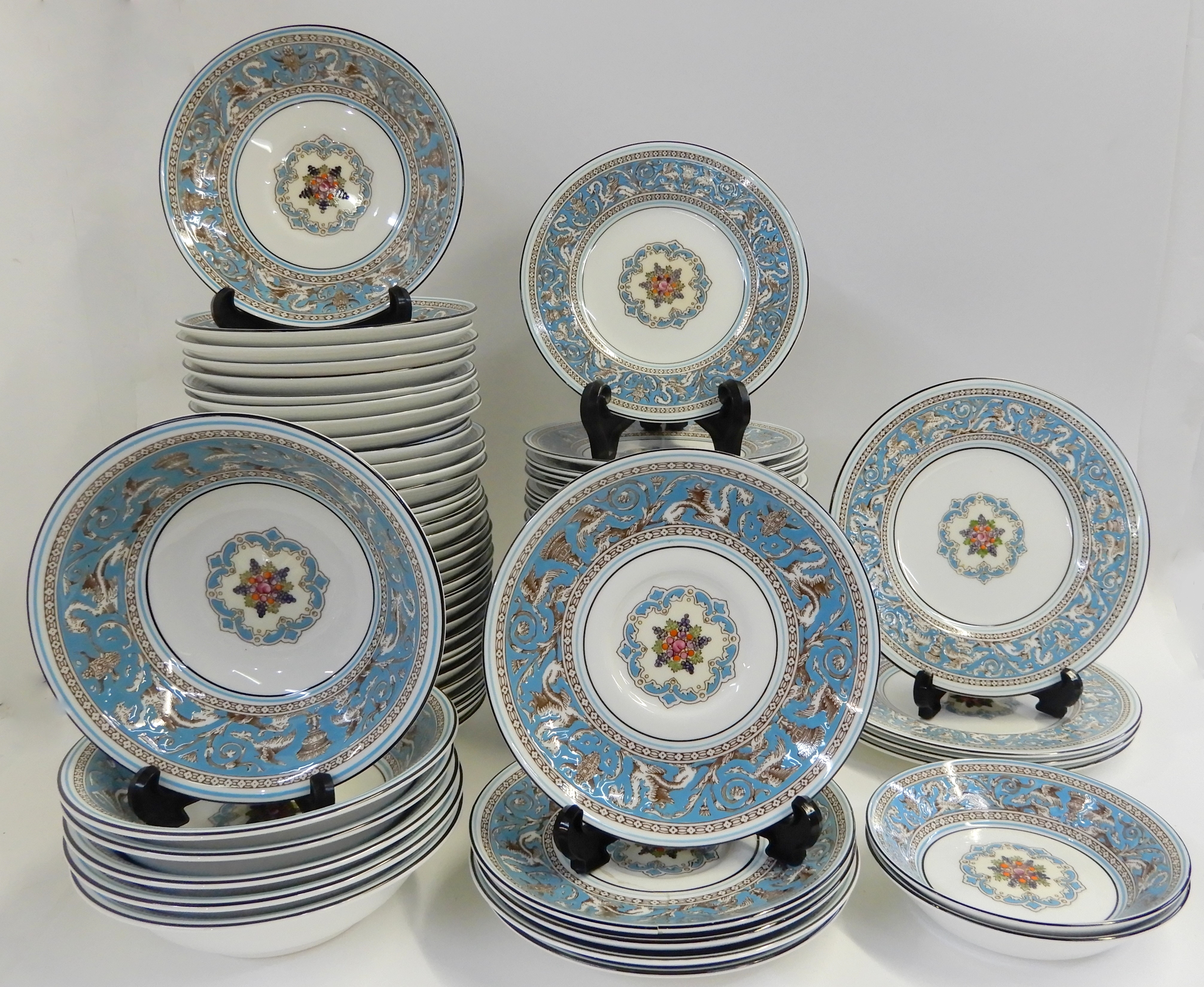 AN EXTENSIVE WEDGWOOD TURQUOISE FLORENTINE DINNER SERVICE comprising