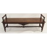A VICTORIAN OAK HALL BENCH with label Constantine & Co., Leeds, the turned arms with barley twist