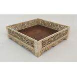 A RARE CHINESE MARINE IVORY AND HUANGHUALI SQUARE TRAY the sides finely carved with foliate