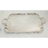 A SILVER SERVING TRAY by Emile Viner, Sheffield 1931, of rectangular form with raised scalloped edge