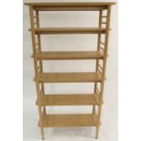 A LIGHT OAK ERCOL TERAMO SHELVING UNIT with open overhanging shelves, 185cm high x 95cm wide x