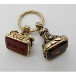 TWO DECORATIVE FOB SEALS an example in carnelian, is intaglio carved with monogram, in bright yellow
