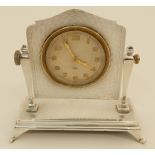 A BOUDOIR CLOCK WITH SWISS 8-DAY MOVEMENT in engine turned decorated sterling silver case modelled