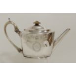 A GEORGE III SILVER TEAPOT by Thomas Wallis II, London 1798, of oval form with band of roundel and