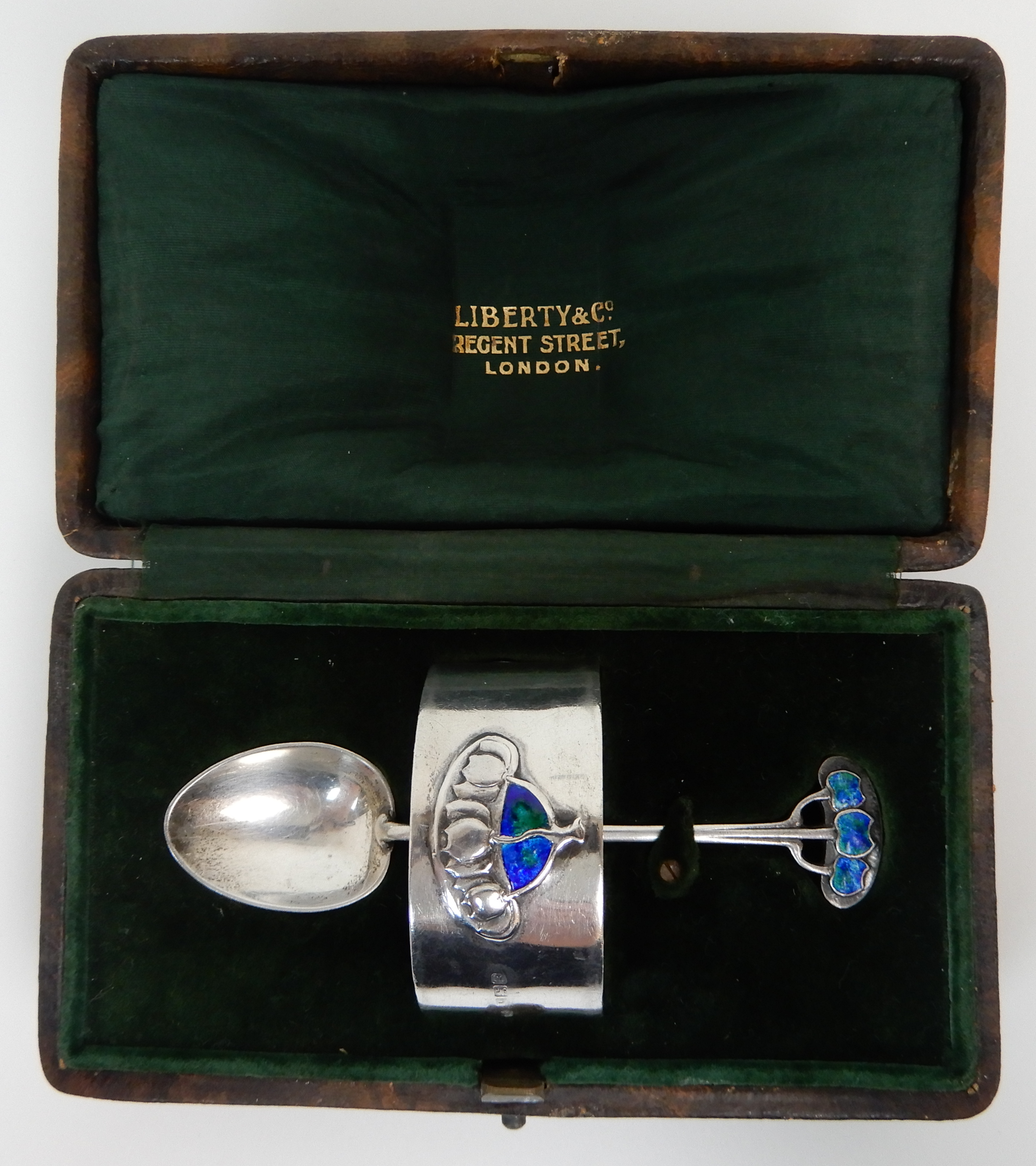 A CASED TWO PIECE ART NOUVEAU SILVER CHRISTENING SET by Liberty & Company, Birmingham 1906 and