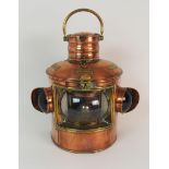 A VICTORIAN COPPER PORT & STARBOARD SHIPS LANTERN with hinged top and swing handle, with interior